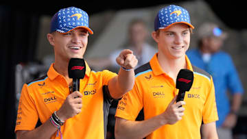 McLaren driver Lando Norris of United Kingdom, left, and McLaren driver Oscar Piastri of Australia, talk to fans at the Driver Engagement event at the Formula 1 Lenovo United States Grand Prix at Circuit of the Americas on Friday October 20, 2023.