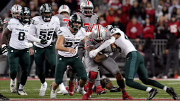 Nov 11, 2023; Columbus, Ohio, USA; Ohio State Buckeyes tight end Cade Stover (8) is tackled by Michigan State Spartans defensive back Malik Spencer (43) during the NCAA football game against Michigan State University at Ohio Stadium.