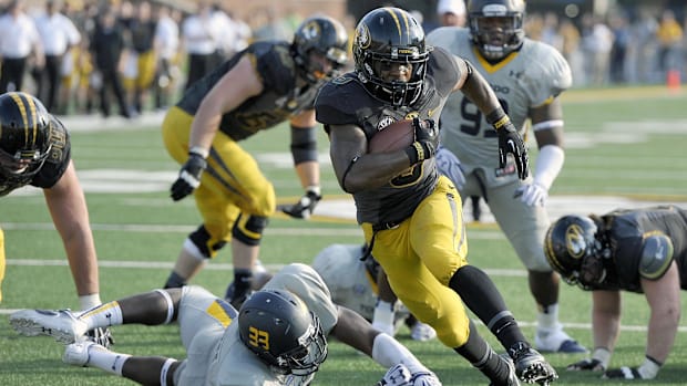 Missouri Tigers running back Marcus Murphy (6) scores a touchdown against the Toledo Rockets during the second half.