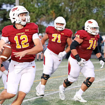 Ankeny High senior quarterback and Iowa State recruit JJ Kohl (12) throws on the run against Ankeny Centennial on Friday, September 2, 2022, at Ankeny Stadium.