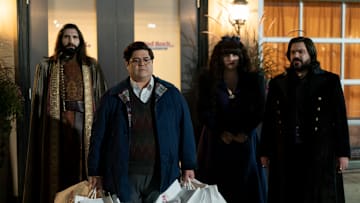 “WHAT WE DO IN THE SHADOWS” -- “The Mall” -- Season 5, Episode 1 (Airs July 13) — Pictured (L-R): Kayvan Novak as Nandor, Harvey Guillén as Guillermo, Natasia Demetriou as Nadja, , Matt Berry as Laszlo. CR: Russ Martin: FX