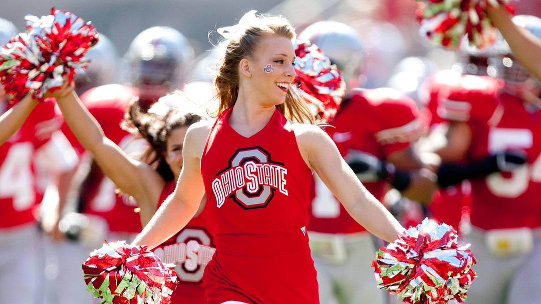 Ohio State Buckeyes cheerleaders lead their team onto the field before the game against Ohio Bobcats at Ohio Stadium.  Mandatory Credit: Greg Bartram-USA TODAY Sports