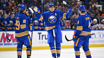 Buffalo Sabres players Alex Tuch, Tage Thompson and Bowen Byram