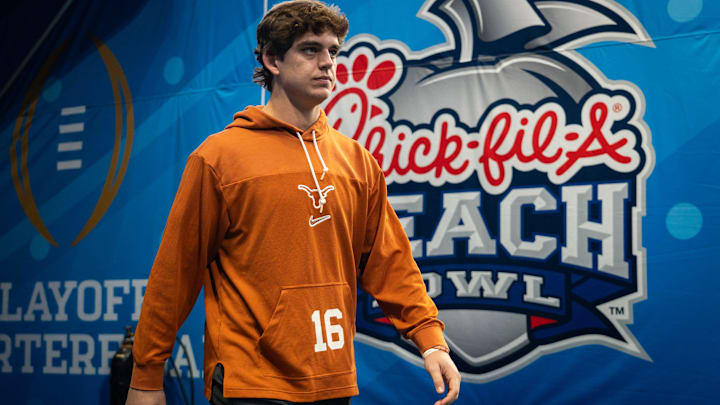 Texas Longhorns quarterback Arch Manning (16) walks onto the field as the Texas Longhorns prepare to play the Arizona State Sun Devils in the Peach Bowl College Football Playoff quarterfinal.