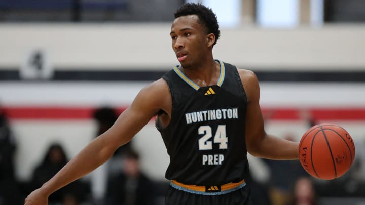 Huntington Prep guard Darryn Peterson takes the ball up the court during the first half at Canton Memorial Field House, Saturday, Feb. 17, 2024.