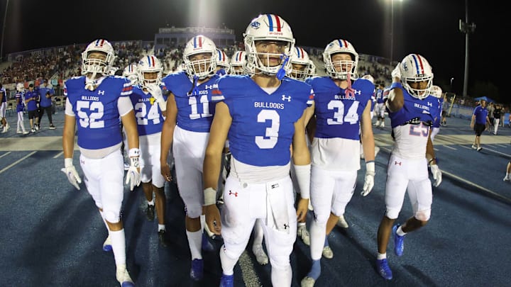 Ryder Lyons leads his teammates across the field for the postgame handshake with Long Beach Poly players and coaches. Ryder Lyons leads his teammates across the field for the postgame handshake with Long Beach Poly players and coaches.