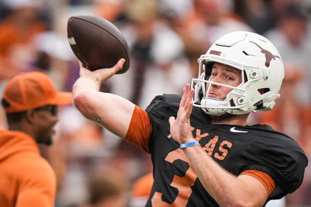 Texas Longhorns quarterback Quinn Ewers throws a pass while warming up ahead of the Longhorns' spring Orange and White game.