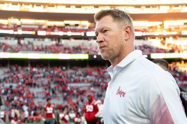 Coach Scott Frost walks off the field after Nebraska's loss to Purdue in 2021.