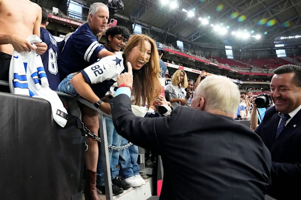 Dallas Cowboys owner Jerry Jones signs autographs for the Cowboys fans before the game against the Arizona Cardinal.