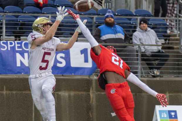 Toledo Central Catholic's Victor Singleton breaks up a pass intended for Bishop Watterson's Christopher Bair on Dec. 1, 2023.