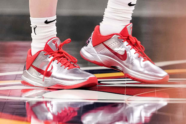 Caitlin Clark's silver and red Nike Kobe sneakers.
