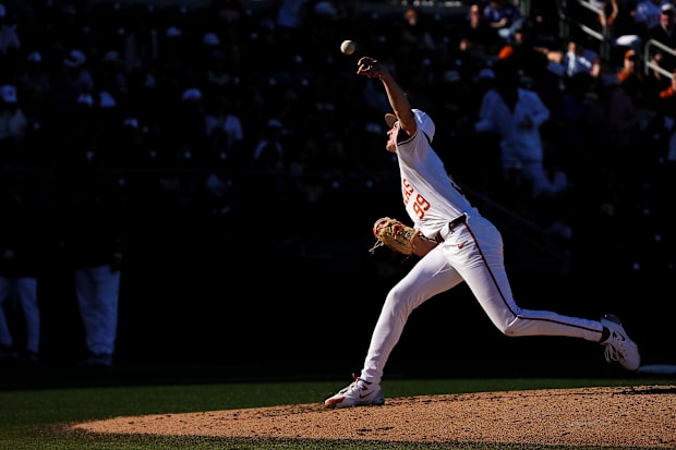 Texas Longhorns pitcher Dylan Volantis throw a pitch during the annual Texas baseball alumni game at UFCU Disch-Falk Field