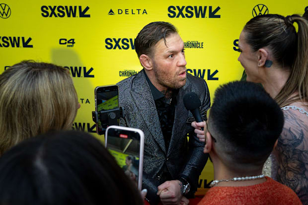 Conor McGregor speaks to press on the red carpet before the premiere of Road House at the Paramount Theatre in Austin, Texas.