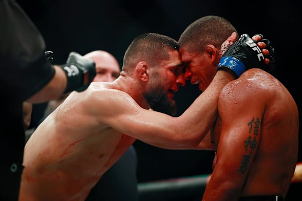 Khamzat Chimaev congratulates Gilbert Burns on a valiant effort Saturday during UFC 273 at VyStar Veterans Memorial Arena.