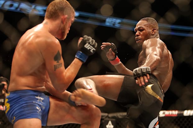Jon Jones fights Alexander Gustafsson (left) during their light heavyweight championship bout at UFC 165.