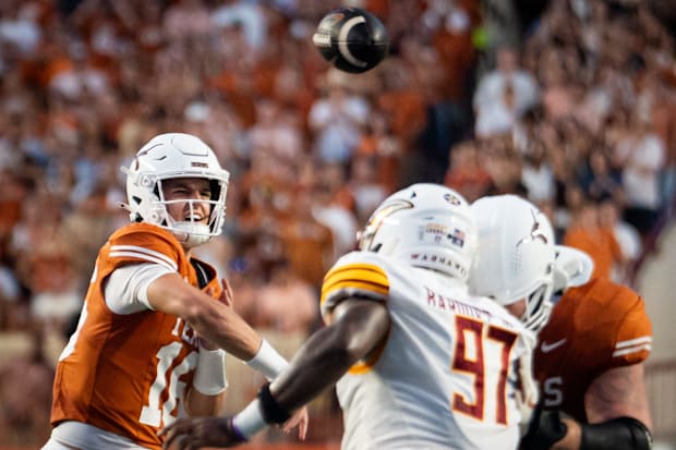 Manning throws a pass in the first half.