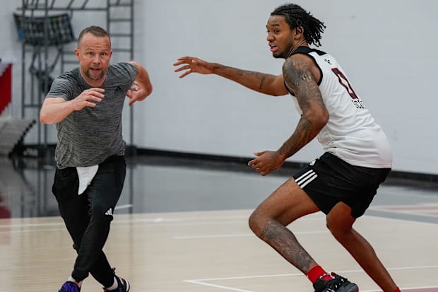 Kelsey runs through a drill with Scott last summer.