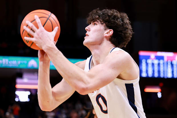 Virginia Cavaliers forward Blake Buchanan shoots the ball.