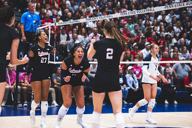 Nebraska players celebrate a point at Penn State. The Huskers swept the Nittany Lions 25-6, 25-15, 25-13.
