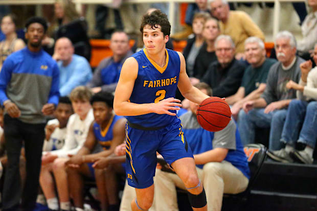 Fairhope's Riley Leonard (2) dribbles the ball during the McGill-Toolen vs Fairhope boys basketball game.