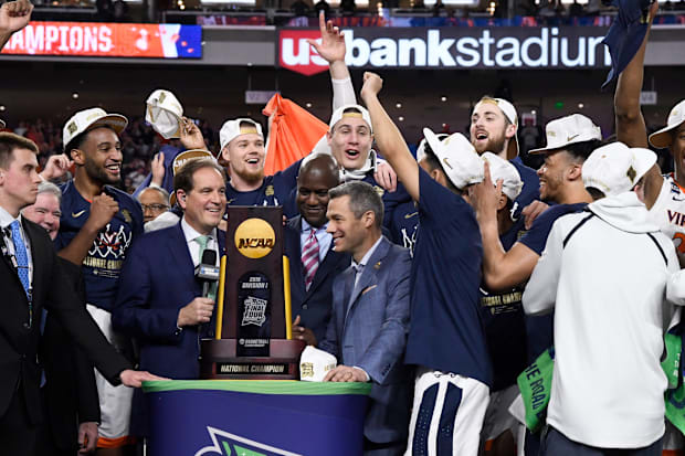 Virginia players are presented with the NCAA championship trophy in 2019