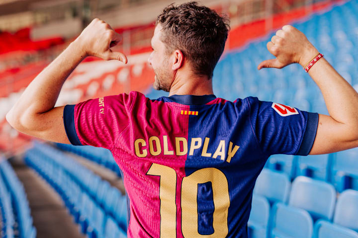 The Barcelona home shirt with Coldplay printed on the back