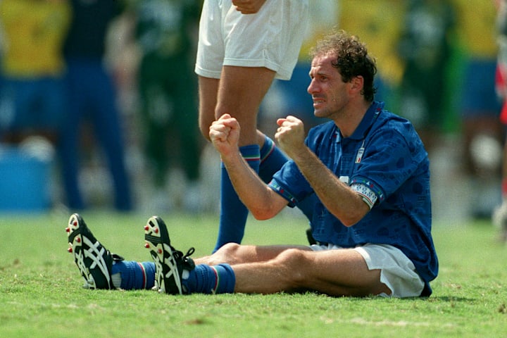 Franco Baresi with clenched fists while sat down.