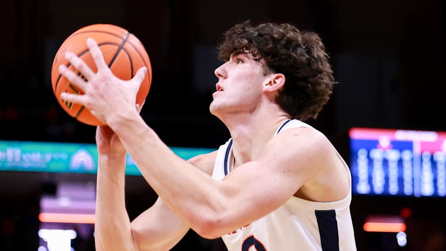 Virginia Cavaliers forward Blake Buchanan shoots the ball.