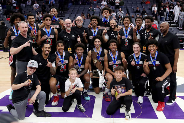 Jared McCain proudly holds the trophy following Centennial's victory over Modesto Christian in the 2022 CIF State Open Division championship game at Golden 1 Center in Sacramento. 