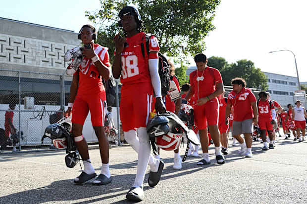 Mater Dei football players arrive at the Santa Ana Bowl before their showdown with Bishop Gorman on Friday, Sept. 6, 2024.