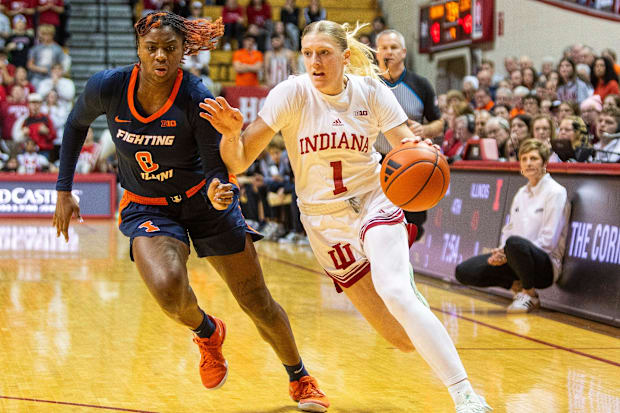 Indiana's Lexus Bargesser (1) drives on Illinois Jasmine Brown-Hagger (8) during the Indiana versus Illinois.