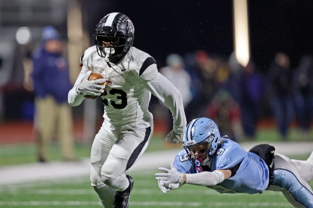 Aliquippa running back Tiqwai Hayes gets away from a Dallas defender during the 2023 PIAA Class 4A state championship game. 