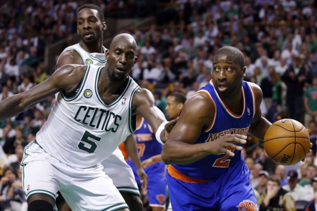 May 3, 2013; Boston, MA, USA; New York Knicks point guard Raymond Felton (2) drives the ball against Boston Celtics center Kevin Garnett (5) in game six of the first round of the 2013 NBA Playoffs at TD Garden. The New York Knicks defeated the Celtics 88-80. Mandatory Credit: David Butler II-USA TODAY Sports