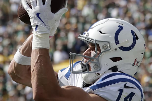 Indianapolis Colts wide receiver Alec Pierce catches a touchdown pass in a white jersey.