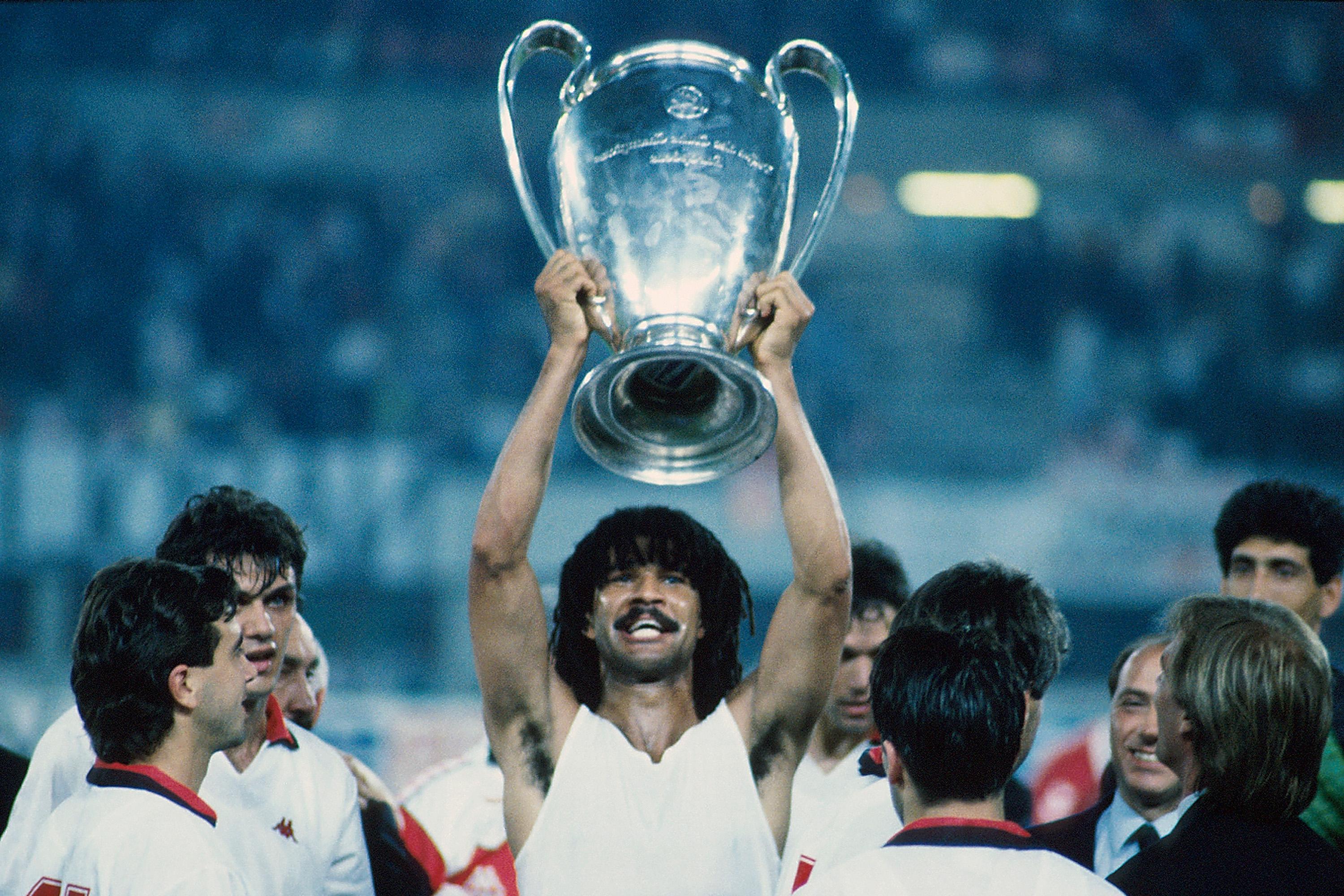 Ruud Gullit hoisting aloft the European Cup.