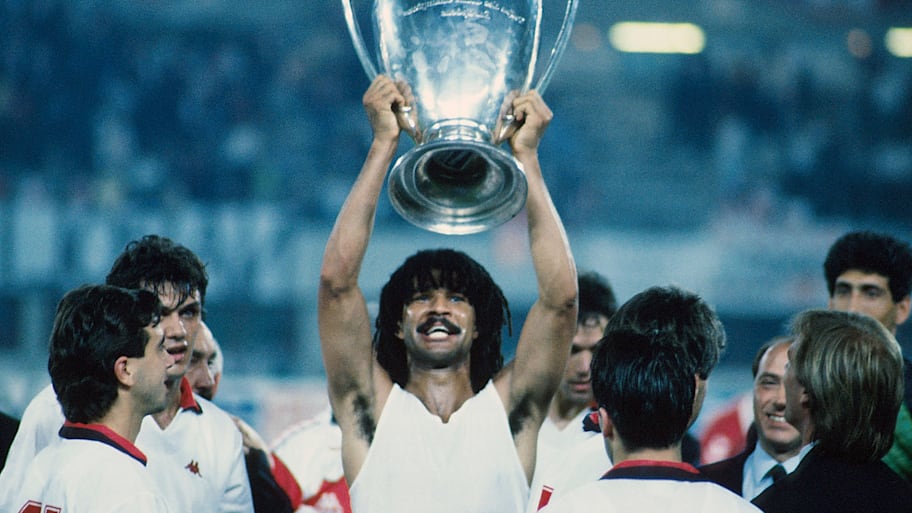 Ruud Gullit hoisting aloft the European Cup.