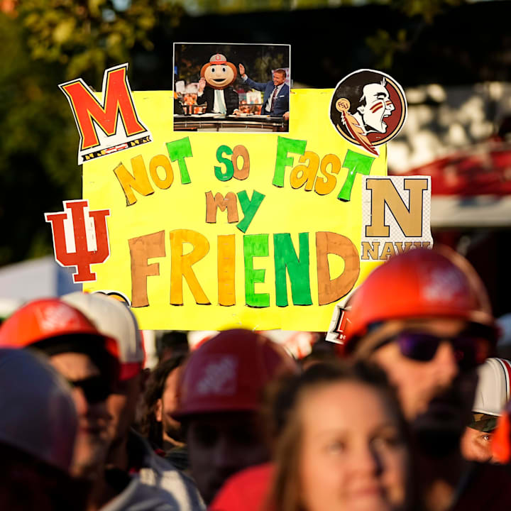 Fans hold signs in support of Lee Corso on the set of ESPN College GameDay prior to the NCAA football game between the Ohio S