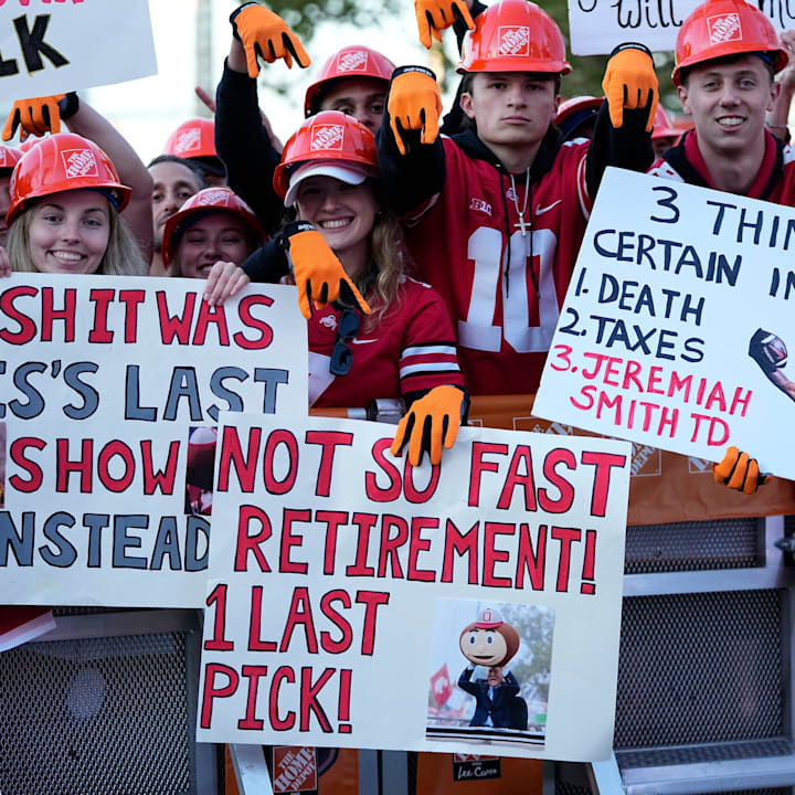 Fans hold signs in support of Lee Corso on the set of ESPN College GameDay prior to the NCAA football game between the Ohio S