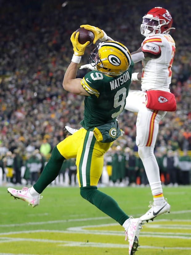 Green Bay Packers receiver Christian Watson (9) catches a touchdown pass in front of Chiefs cornerback Joshua Williams.