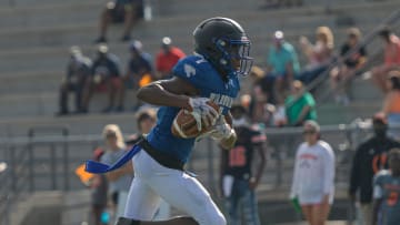 Wildwood   s Vernell Brown III (1) runs with the ball during a 2021 preseason jamboree at Leesburg High School in Leesburg. Brown recently received an offer to play for the Univeristy of Michigan. [PAUL RYAN / CORRESPONDENT]

Preseason Jamboree