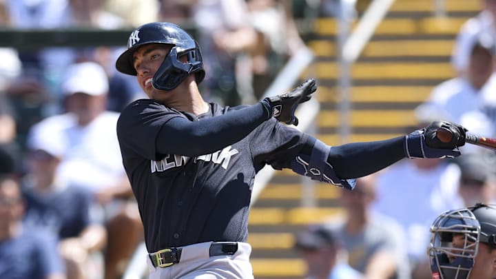 Feb 27, 2026; Fort Myers, Florida, USA; New York Yankees shortstop George Lombard Jr. (96) hits a two-rbi single against the Minnesota Twins in the first inning during spring training at Lee Health Sports Complex/Hammond Stadium. Mandatory Credit: Nathan Ray Seebeck-Imagn Images