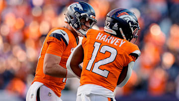 Oct 19, 2025; Denver, Colorado, USA; Denver Broncos quarterback Bo Nix (10) celebrates the touchdown of running back RJ Harvey (12) in the fourth quarter against the New York Giants at Empower Field at Mile High. 