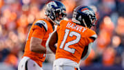 Oct 19, 2025; Denver, Colorado, USA; Denver Broncos quarterback Bo Nix (10) celebrates the touchdown of running back RJ Harvey (12) in the fourth quarter against the New York Giants at Empower Field at Mile High.  