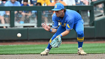 Jun 14, 2025; Omaha, Neb, USA;  UCLA Bruins shortstop Roch Cholowsky (1) fields a ground ball against the Murray State Racers during the ninth inning at Charles Schwab Field. Mandatory Credit: Steven Branscombe-Imagn Images