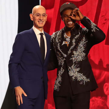 Jun 22, 2023; Brooklyn, NY, USA; Scoot Henderson with NBA commissioner Adam Silver after being selected third by the Portland Trail Blazers in the first round of the 2023 NBA Draft at Barclays Arena. Mandatory Credit: Wendell Cruz-USA TODAY Sports