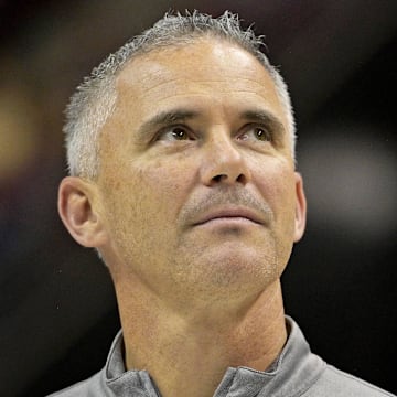 Mar 9, 2024; Tallahassee, Florida, USA; Florida State Seminoles head football coach Mike Norvell accepts the Bear Bryant coach of the Year award during a media timeout of a basketball game against the Miami Hurricanes at Donald L. Tucker Center. Mandatory Credit: Melina Myers-Imagn Images