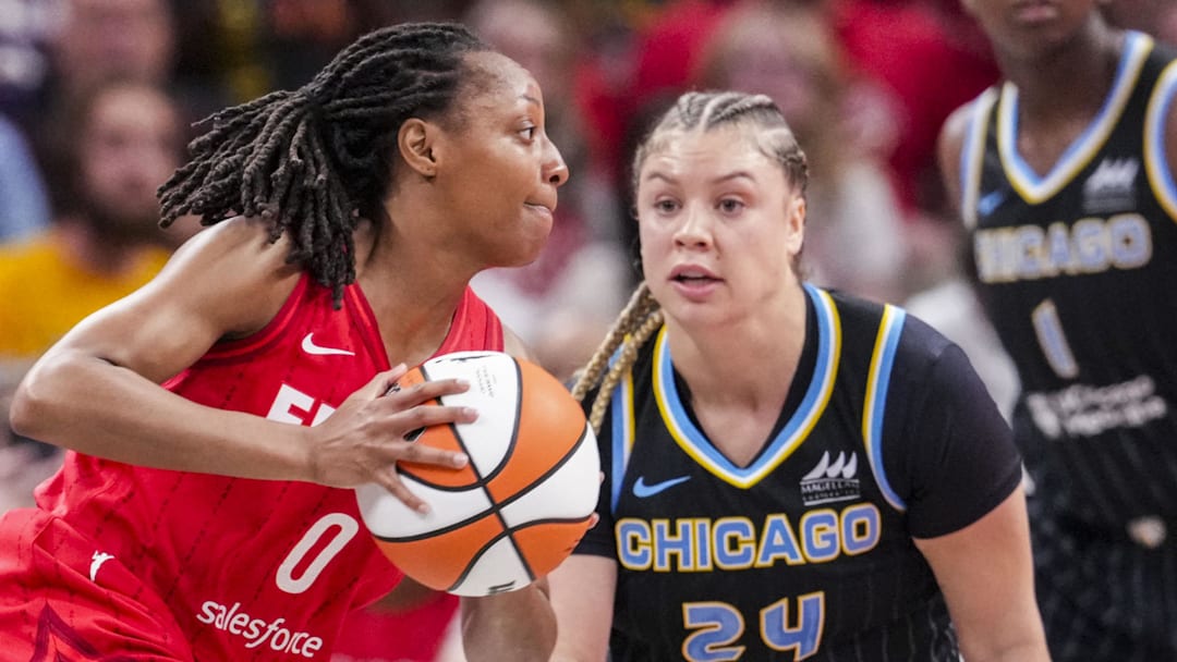 Sep 5, 2025; Indianapolis, Indiana, USA; Indiana Fever guard Kelsey Mitchell (0) dribbles the ball past Chicago Sky guard Rachel Banham (24) during the first half at Gainbridge Fieldhouse. Mandatory Credit: Grace Smith-USA TODAY Network via Imagn Images