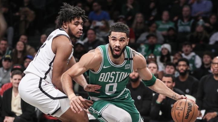 Feb 13, 2024; Brooklyn, New York, USA;  Boston Celtics forward Jayson Tatum (0) drives past Brooklyn Nets guard Cam Thomas (24) in the first quarter at Barclays Center. Mandatory Credit: Wendell Cruz-USA TODAY Sports