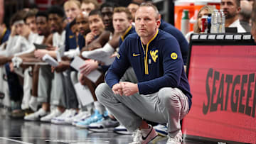 Mar 12, 2025; Kansas City, MO, USA; West Virginia Mountaineers coach Darian DeVries watches game play during the first half against the Colorado Buffaloes at T-Mobile Center. Mandatory Credit: William Purnell-Imagn Images