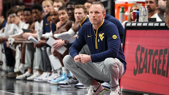 West Virginia Mountaineers coach Darian DeVries watches game play during the first half against the Colorado Buffaloes at T-Mobile Center. West Virginia Mountaineers coach Darian DeVries watches game play during the first half against the Colorado Buffaloes at T-Mobile Center.